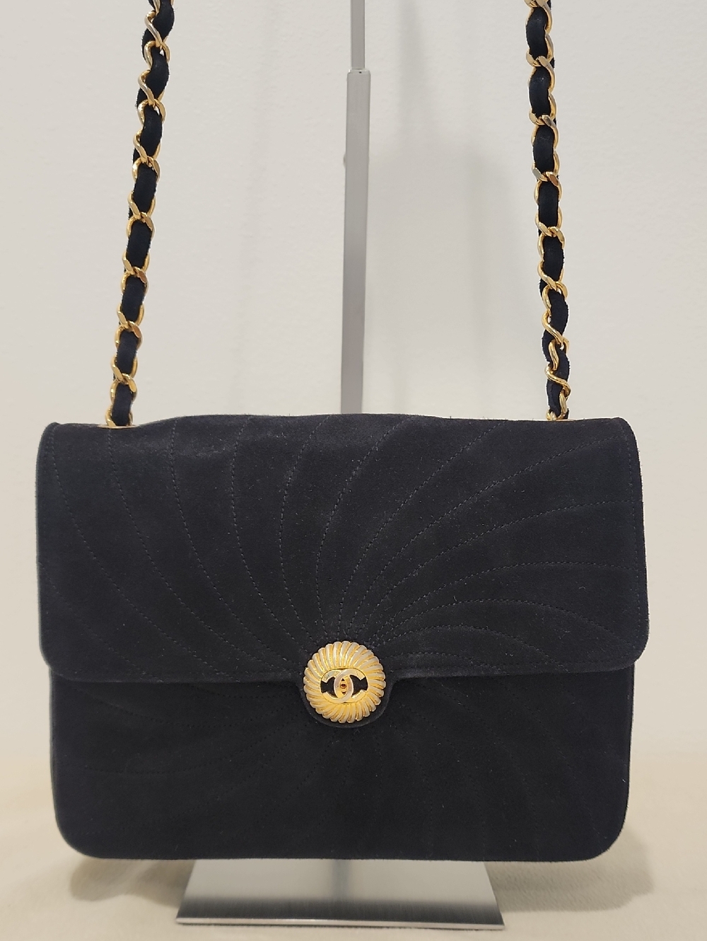 Chanel swirl suede shoulder bag. Minor fading on hardware. Hologram not present.